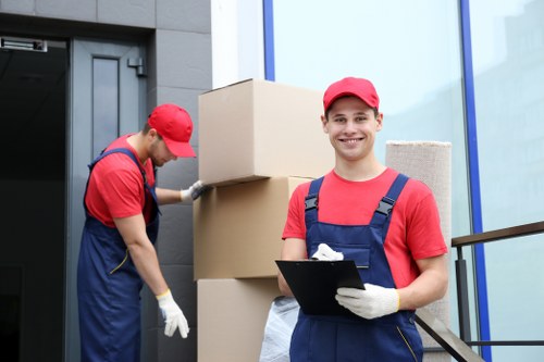 Trained movers using proper equipment during a house move