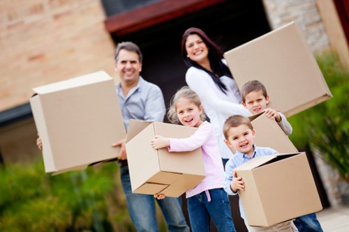 Careful loading of bulky items during a local furniture collection